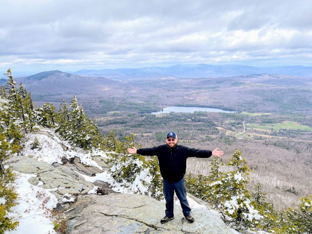 Photo of man at the top of Mt Cube